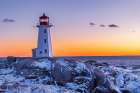 Peggys Cove Lighthouse in winter at sunset, Nova Scotia, Canada. Art Print
